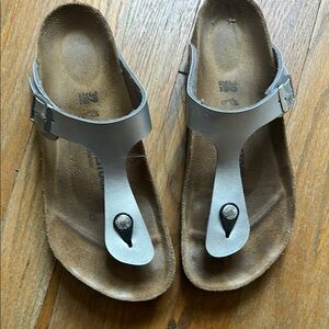 Metallic silver thong Birkenstocks with buckle